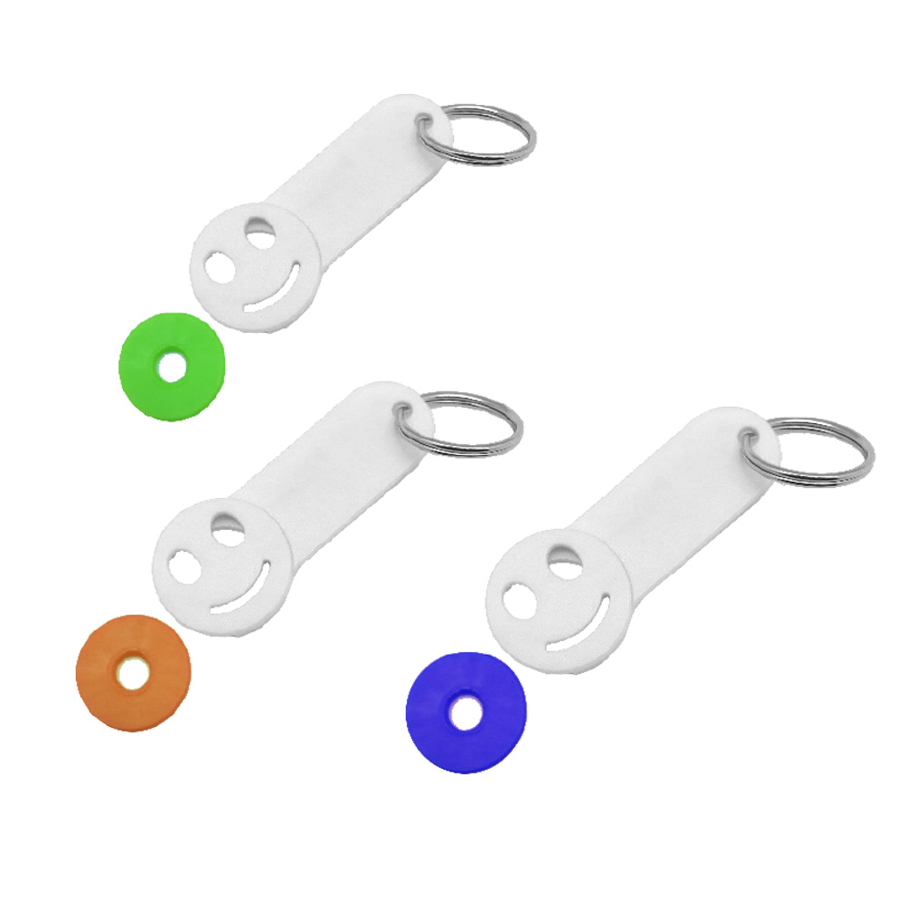 קיון -מחזיק מפתחות בצורת סמיילי עם מטבע נשלף לשחרור עגלות.
